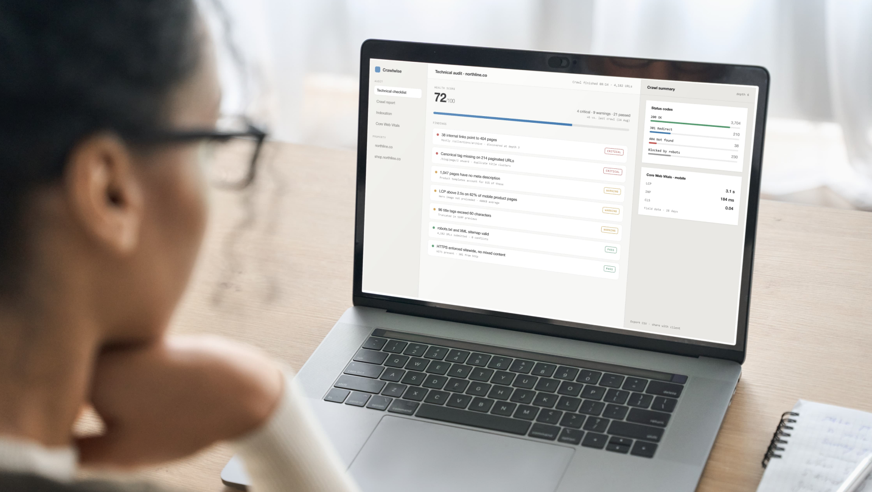 SEO specialist reviewing a website audit checklist and crawl report on screen