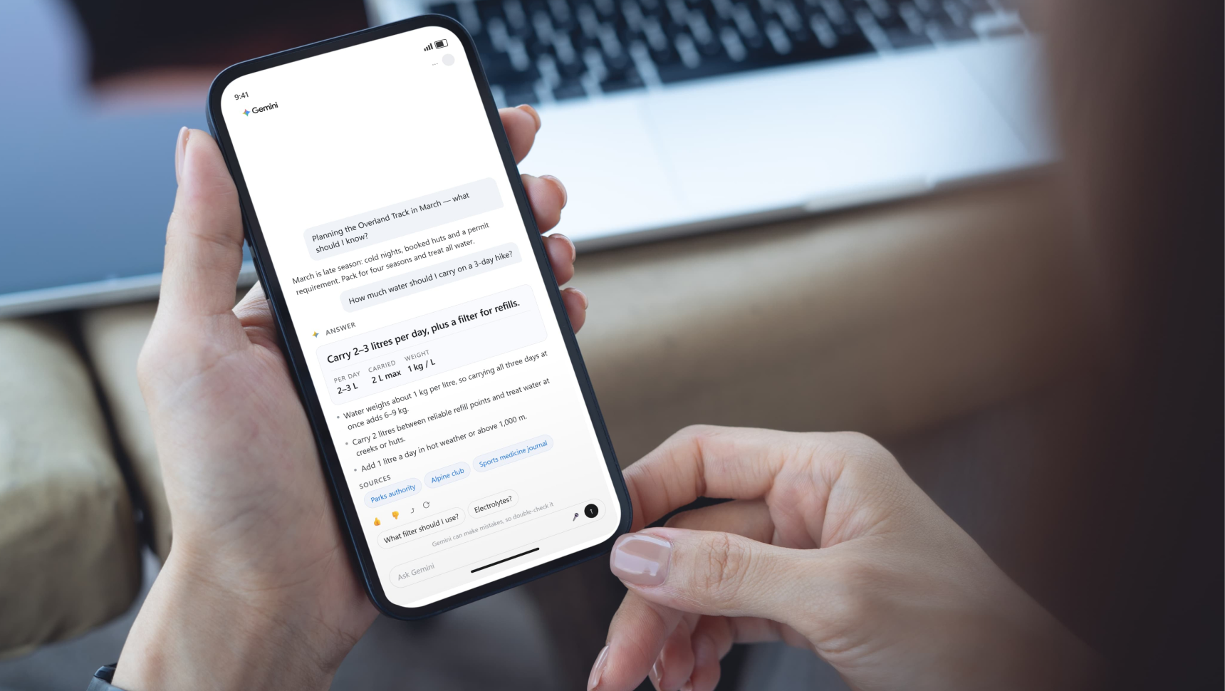 Phone screen showing a Gemini AI chat response with a direct answer and sources