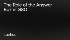 Laptop screen showing an AI assistant direct answer box with cited sources